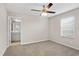 Bright bedroom featuring ensuite bathroom access and large window at 32346 Sapna Chime Dr, Wesley Chapel, FL 33545