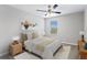 Light-filled bedroom featuring modern furnishings, a ceiling fan, and bright décor at 32346 Sapna Chime Dr, Wesley Chapel, FL 33545