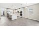 Spacious kitchen with stainless steel appliances, white cabinetry, and a center island at 32346 Sapna Chime Dr, Wesley Chapel, FL 33545