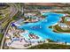 Panoramic aerial view of the Epperson Lagoon, complete with beach, water slides, and aqua obstacle course at 32346 Sapna Chime Dr, Wesley Chapel, FL 33545