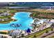 Aerial image of Epperson Lagoon, showing white sand beaches, palm trees and a waterpark at 32346 Sapna Chime Dr, Wesley Chapel, FL 33545