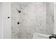 Modern bathroom with a marble shower and matte black fixtures at 3401 E Hanna Ave, Tampa, FL 33610