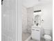 Updated bathroom featuring marble shower, new fixtures, and vanity at 3401 E Hanna Ave, Tampa, FL 33610