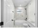 Bathroom featuring shower/tub and modern black fixtures at 3401 E Hanna Ave, Tampa, FL 33610