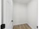 Walk-in closet with fresh white paint and new wood-look floors at 3401 E Hanna Ave, Tampa, FL 33610