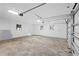 Spacious garage with an automatic door and windows for natural light, great for storage and projects at 3401 E Hanna Ave, Tampa, FL 33610