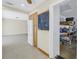 Open-concept kitchen flows into living area, featuring a chalkboard and storage at 5010 109Th N Way, St Petersburg, FL 33708