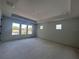 Spacious bedroom with tray ceiling and three large windows at 509 N Bradford Ave, Tampa, FL 33609