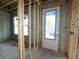 Interior view showing a framed doorway with windows, and green-treated lumber at 509 N Bradford Ave, Tampa, FL 33609