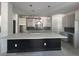 Modern kitchen with large center island, pendant lights, stainless steel appliances, and stylish backsplash at 509 N Bradford Ave, Tampa, FL 33609