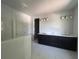 Bright bathroom featuring double vanity, marble flooring, and a glass-enclosed shower at 509 N Bradford Ave, Tampa, FL 33609