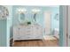 Elegant bathroom with double vanity, modern lighting, and spacious shower at 6029 Bayway Ct, New Port Richey, FL 34652