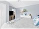 Comfortable bedroom featuring a dresser, closet, and wood-look floors, creating a relaxing retreat at 6029 Bayway Ct, New Port Richey, FL 34652
