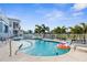 Inviting backyard pool area with a safety fence and tropical landscaping, perfect for relaxation at 6029 Bayway Ct, New Port Richey, FL 34652