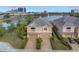 This aerial view shows the front of the property with a two-car garage and a brick-paved driveway at 650 Saxony Blvd, St Petersburg, FL 33716