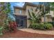 Beautiful tropical landscaping surrounds the home, along with a screened-in patio and pavers at 650 Saxony Blvd, St Petersburg, FL 33716