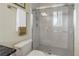 Well-maintained bathroom showcasing a shower with sliding glass doors and a toilet with modern fixtures at 650 Saxony Blvd, St Petersburg, FL 33716