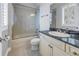 Bathroom includes a tile-surround shower/tub combo, vanity with dark counter, and neutral wall paint at 650 Saxony Blvd, St Petersburg, FL 33716