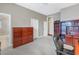 Bedroom contains dark wood furnishings, a ceiling fan, and access to a bathroom at 650 Saxony Blvd, St Petersburg, FL 33716