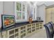 Charming dining area with built-in cabinets, granite countertop, and bright windows with plantation shutters at 650 Saxony Blvd, St Petersburg, FL 33716