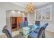Formal dining room featuring a glass table, upholstered chairs, and built-in cabinetry at 650 Saxony Blvd, St Petersburg, FL 33716