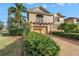 Charming home featuring a manicured lawn, two-car garage, and a welcoming entrance at 650 Saxony Blvd, St Petersburg, FL 33716