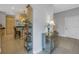 Inviting foyer with tile flooring, a decorative table, and a glimpse into the kitchen at 650 Saxony Blvd, St Petersburg, FL 33716