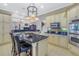 Gourmet kitchen featuring a granite island with seating and stainless steel appliances at 650 Saxony Blvd, St Petersburg, FL 33716