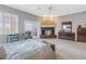 Main bedroom featuring a fireplace, shutters, and neutral carpet at 650 Saxony Blvd, St Petersburg, FL 33716