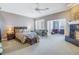 Large main bedroom with fireplace and neutral colored walls at 650 Saxony Blvd, St Petersburg, FL 33716