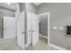 Powder room is well-lit and contains a toilet, towel bar, and is accessible from multiple doorways at 650 Saxony Blvd, St Petersburg, FL 33716