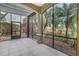 Inviting screened-in patio providing a relaxing outdoor space with views of tropical landscaping at 650 Saxony Blvd, St Petersburg, FL 33716
