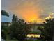 Scenic view with lush green trees and a vibrant sunset sky as its background at 650 Saxony Blvd, St Petersburg, FL 33716