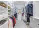 Organized walk-in closet with custom shelving, hanging rods, drawers, and ample storage space at 650 Saxony Blvd, St Petersburg, FL 33716