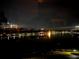 Serene community water view featuring fountain illuminated at night, creating a peaceful and inviting atmosphere at 650 Saxony Blvd, St Petersburg, FL 33716