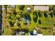 Aerial property view highlighting acreage with home, pool, and landscaped yard, as outlined in red at 7213 Jones Rd, Odessa, FL 33556