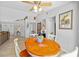 Cozy breakfast nook is adjacent to living room with lovely backyard views at 7213 Jones Rd, Odessa, FL 33556
