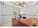 Office space with a ceiling fan, window, and a spacious desk, ideal for remote work at 7213 Jones Rd, Odessa, FL 33556