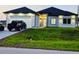 Charming single-story home with well-maintained lawn, attached garage, and modern design features at 13224 Foresman Blvd, Port Charlotte, FL 33981