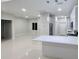 Open concept view of the kitchen with modern lighting, stainless appliances and tile floors at 13224 Foresman Blvd, Port Charlotte, FL 33981