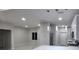 Open concept view of the kitchen with modern lighting, stainless appliances and tile floors at 13224 Foresman Blvd, Port Charlotte, FL 33981