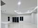 Bright living area with recessed lighting, and glass sliding doors that fill the room with natural light at 13224 Foresman Blvd, Port Charlotte, FL 33981