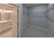 Spacious walk-in closet and a view of a full bathroom with double vanity and modern lighting at 13224 Foresman Blvd, Port Charlotte, FL 33981