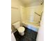Functional bathroom with a combined shower and tub and convenient grab bar at 200 Country Club Dr # 407, Largo, FL 33771