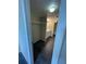 Bathroom adjacent to a closet featuring a single sink vanity and bathtub at 200 Country Club Dr # 407, Largo, FL 33771