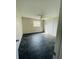 Spacious bedroom with tiled floors, a window, and a ceiling fan at 200 Country Club Dr # 407, Largo, FL 33771