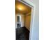 Open closet space for storage and a view to an attached bathroom at 200 Country Club Dr # 407, Largo, FL 33771