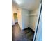 Hallway with tiled floors leading to a closet and bathroom at 200 Country Club Dr # 407, Largo, FL 33771