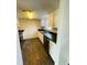 Efficient kitchen featuring modern appliances, sleek countertops and ample cabinetry space for convenient storage solutions at 200 Country Club Dr # 407, Largo, FL 33771