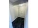 Functional laundry room featuring tile flooring and ample space for laundry appliances and storage needs at 200 Country Club Dr # 407, Largo, FL 33771